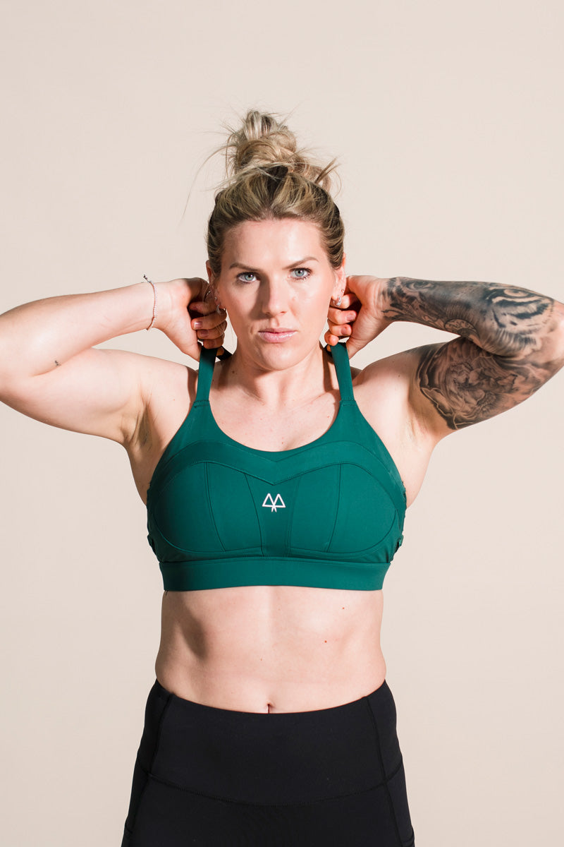 Millie_bright_wearing_forest_green_solidarity_sports_bra_maaree_high_impact