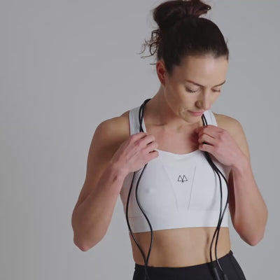 White sports bra with a MAAREE logo on a neutral background